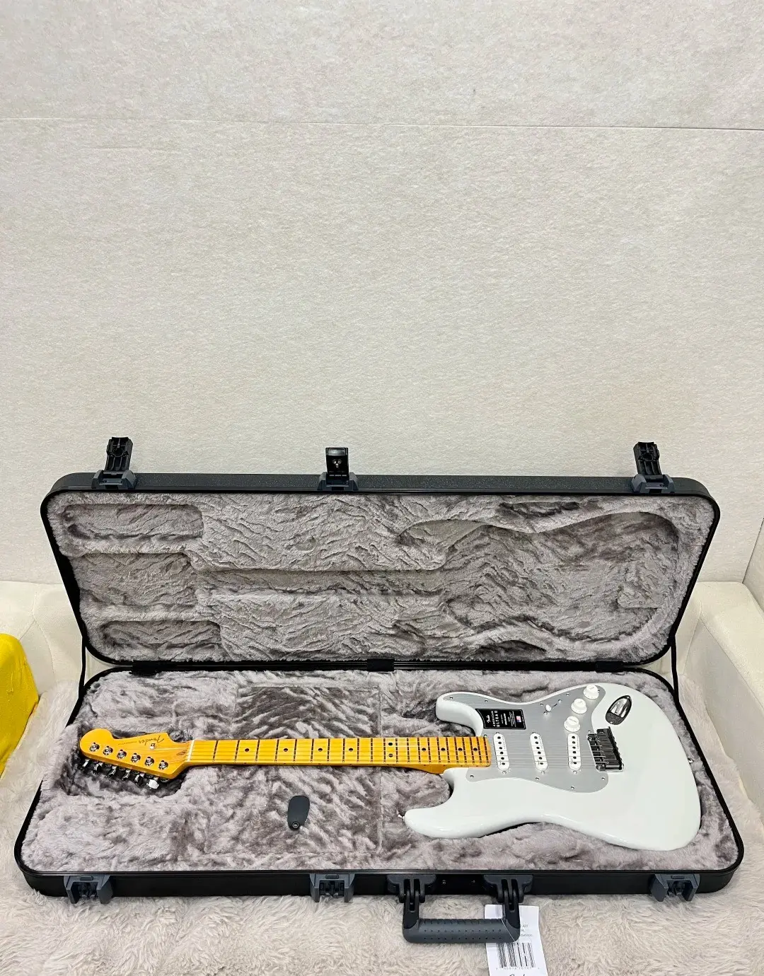 White Fender Stratocaster in its case
