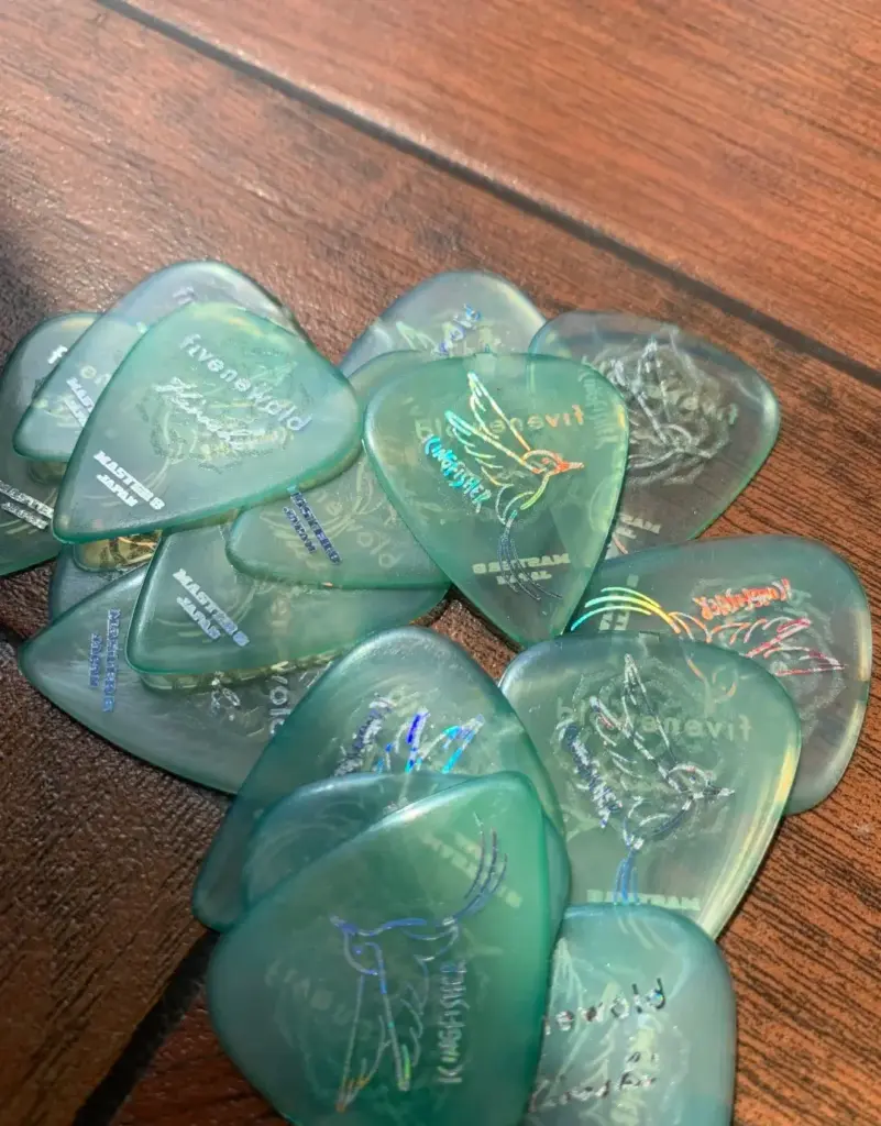 Green guitar picks (plectrums)